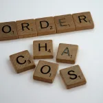 brown wooden letter blocks on white surface